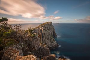Looking over a peak and seeing the sky meet the ocean.