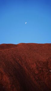 Large rock face and blue sky