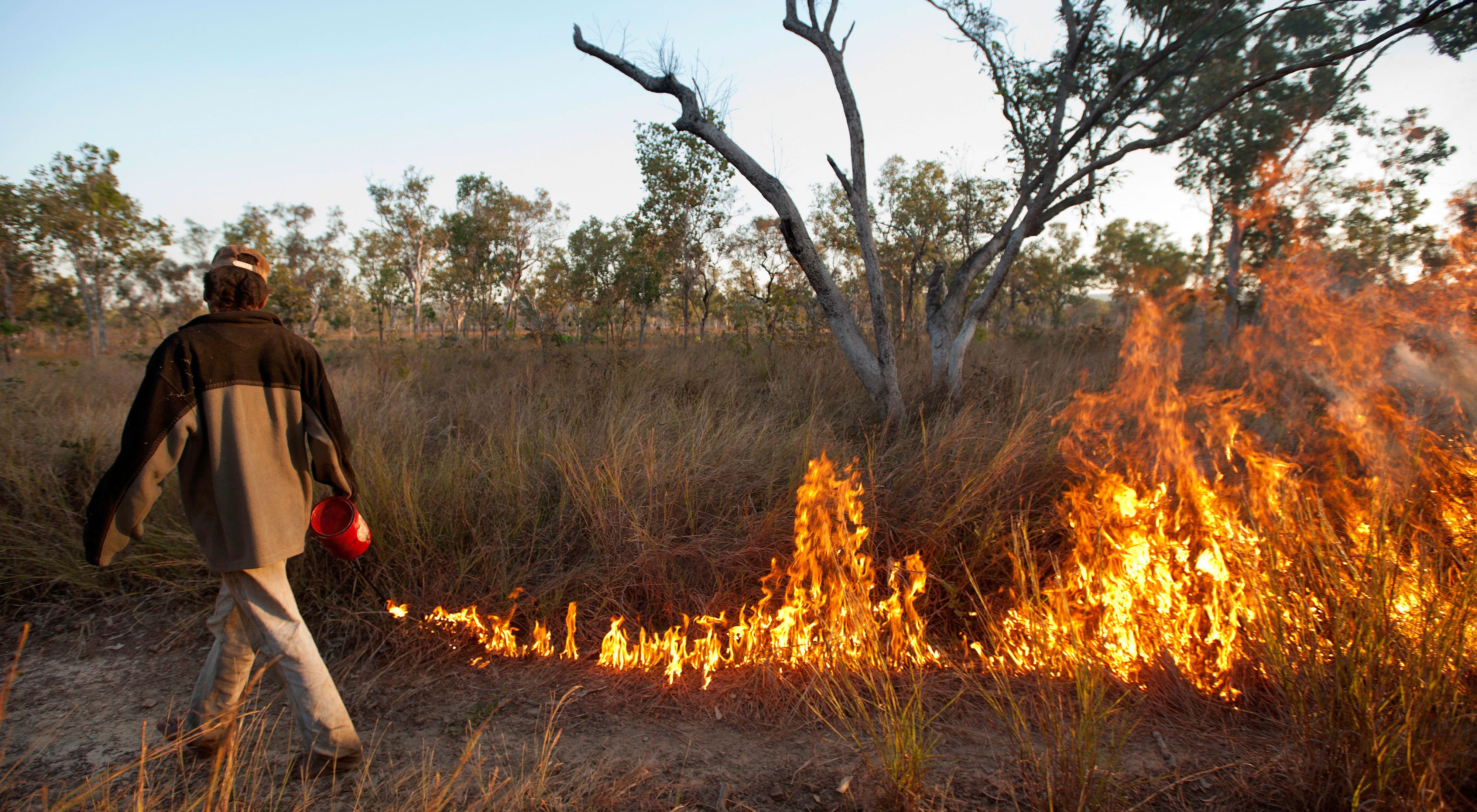 An early dry-season controlled burn being conducted by local aboriginal rangers on Fish River Station in Australia's Northern Territory. 