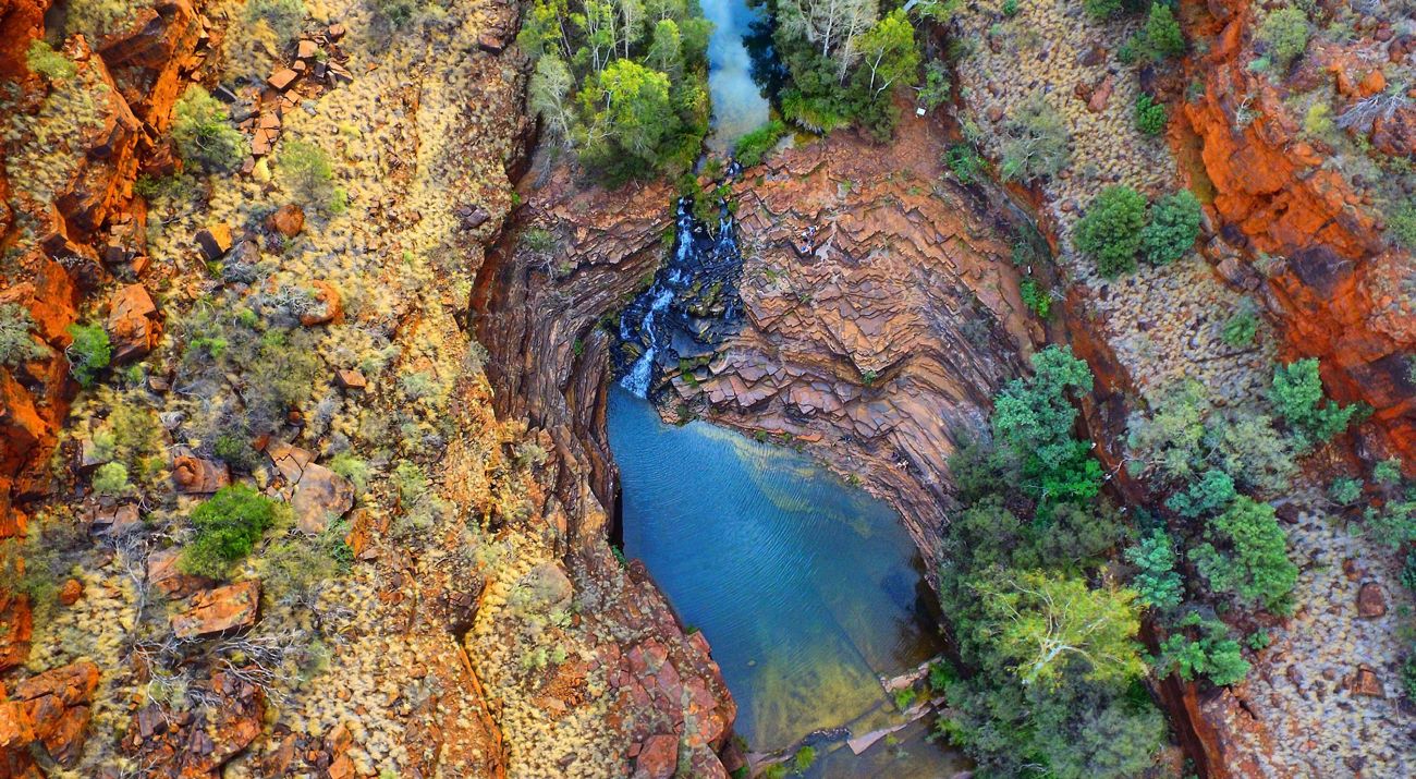 bright blue river flowing through a canyon