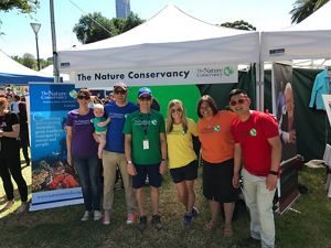 a group of people in multicolored shirts