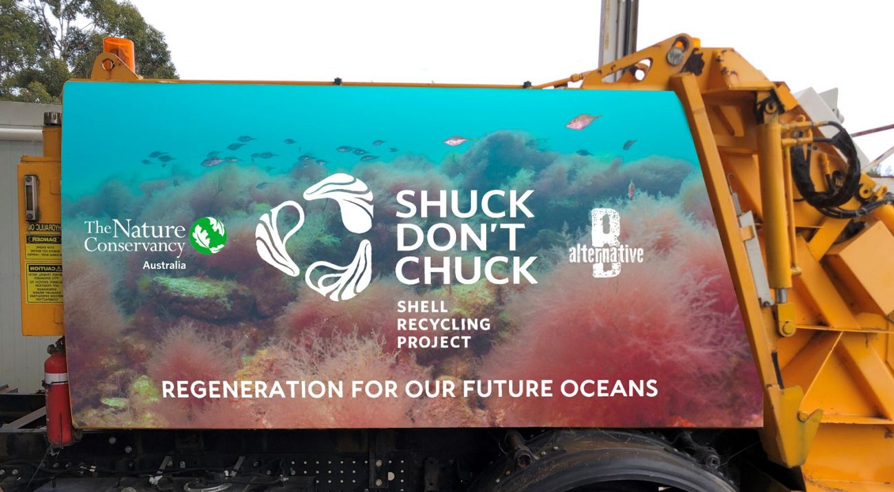 An image showing the side of a Shuck Don't Chuck truck showing the logo and the words 'Regeneration for our future oceans'.