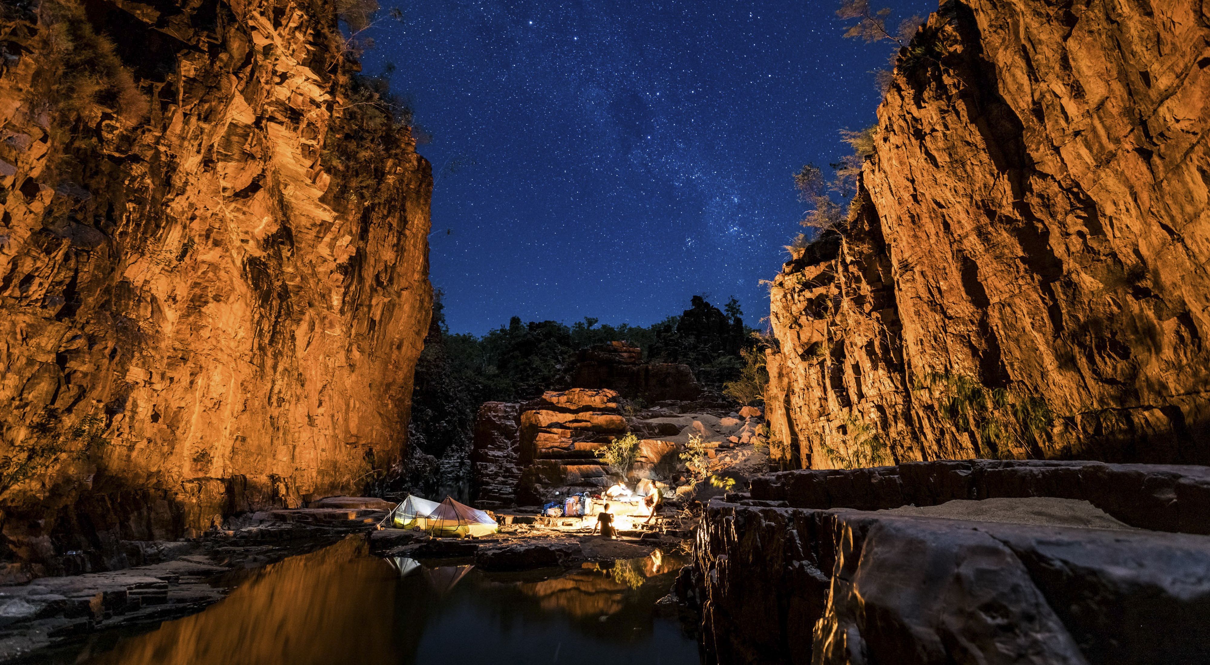 Camping under the stars in a remote sandstone gorge in the Northern Territory