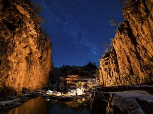 Camping under the stars in a remote sandstone gorge in the Northern Territory