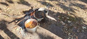 Natural dye being prepared in pans.