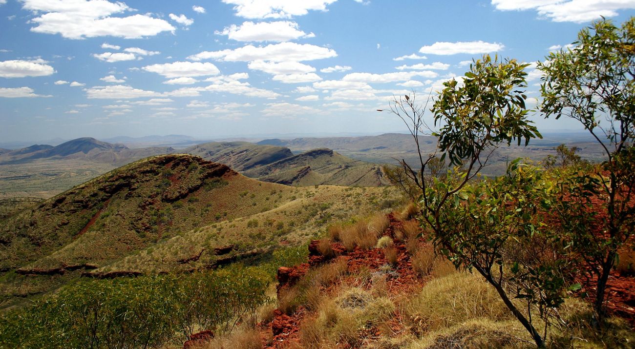view of a mountain range under a blue sky
