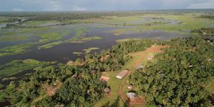 An aerial view of parts of a village and a lagoon in Papua New Guinea.