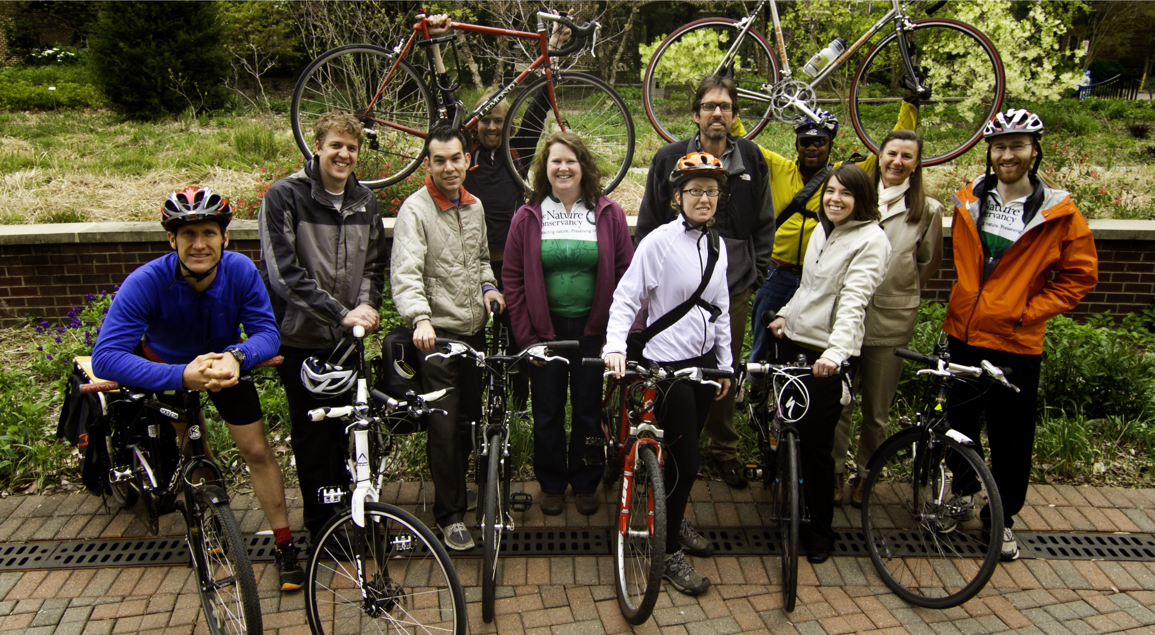 Ten Nature Conservancy employees show off the bikes they use for commuting to work.