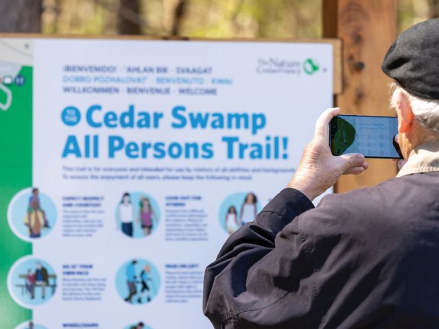 Sign at the Manchester Cedar Swamp All Persons Trail was carefully designed to serve a variety of purposes.