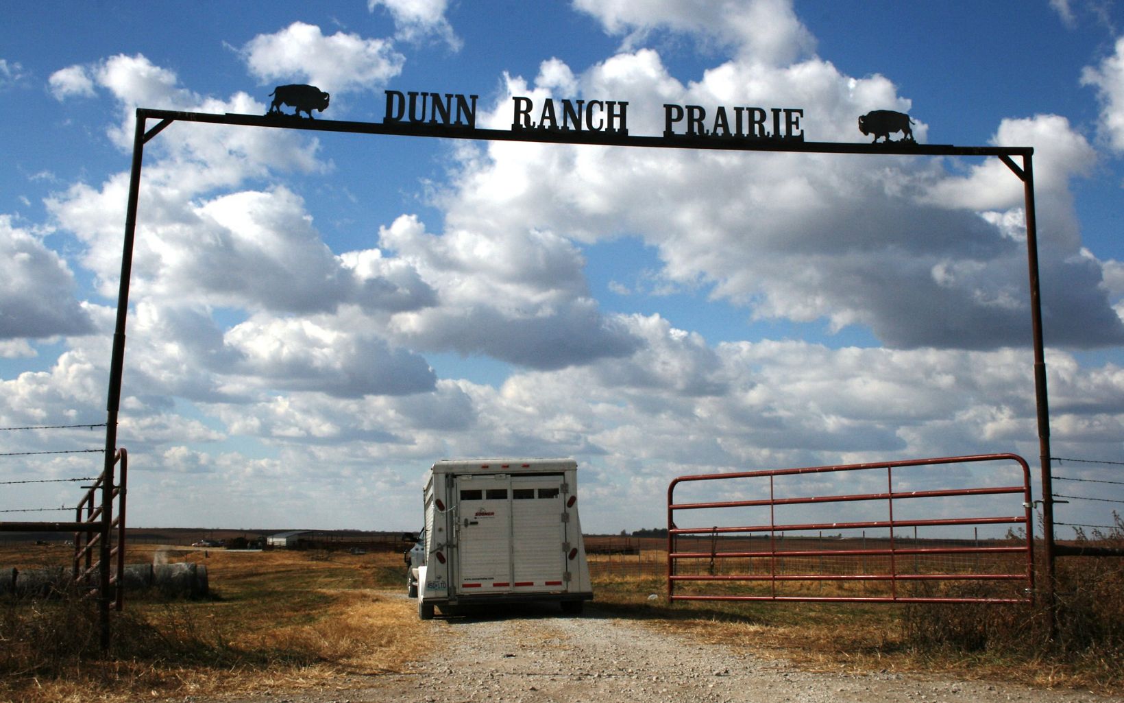 A trailer is pulled through the gates of Dunn Ranch Prairie.
