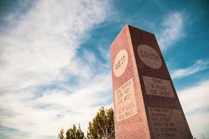 Directional monument showcasing the tri-state border with Colorado, New Mexico and Texas.