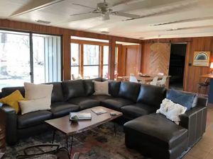 Living room with black couch.