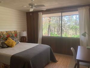 bedroom with large window.