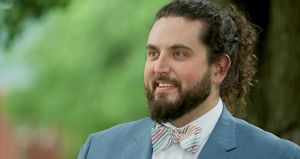 A photo of Boone Bowling, a smiling man with a beard and a bowtie.