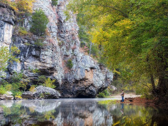 Man fishing on the shore of the Buffalo National River.