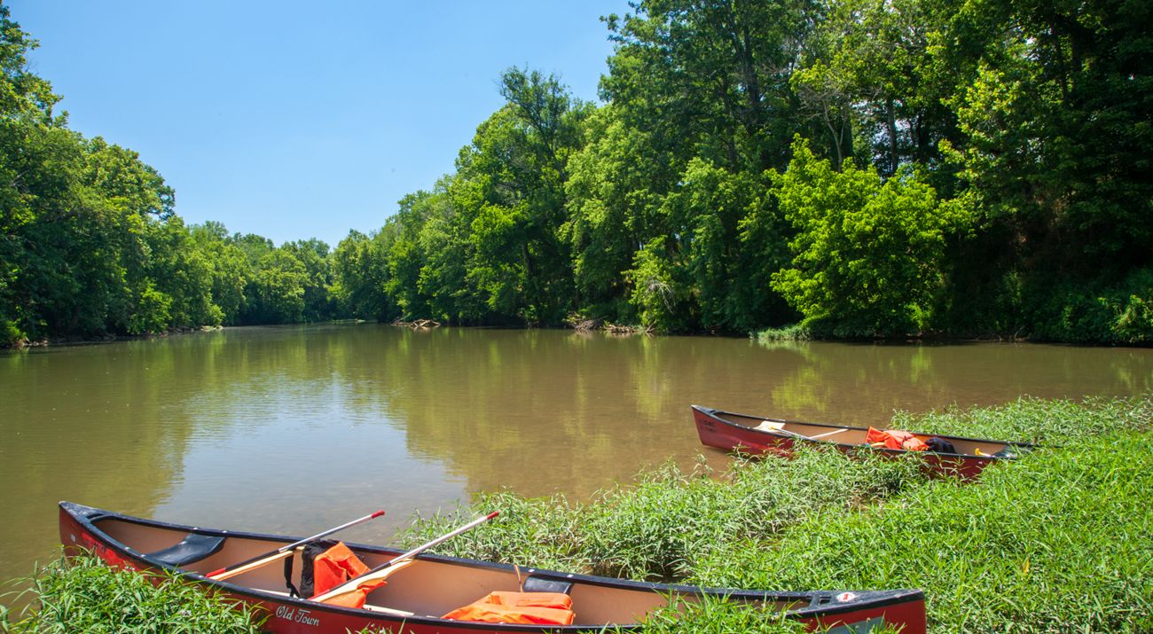 Two boats and the Duck river in the background.