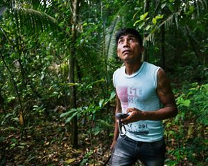 Bepnhibety Xikrin surveying restoration efforts in a forest near the Pot-Kro Village, Brazil. He marks the location of Brazil nut trees in his GPS.  This work is part of the Conservancy and community's ethnomapping effort to identify and preserve areas of the forest that are especially important to the community. Our innovation is enabling compliance with Brazil’s progressive Forest Code, while increasing economic opportunity. We are working with indigenous peoples to integrate traditional knowledge with modern approaches to landscape planning in order to enable greater leadership in deciding how their traditional territories will be managed and to have a stronger voice in policy decisions.