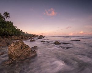 A view of the coastline at sunset near the village of Utwe on the island of Kosrae in Micronesia.