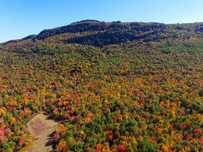 A mountain bursting with fall color.