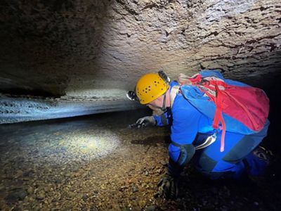 Man exploring a cave.