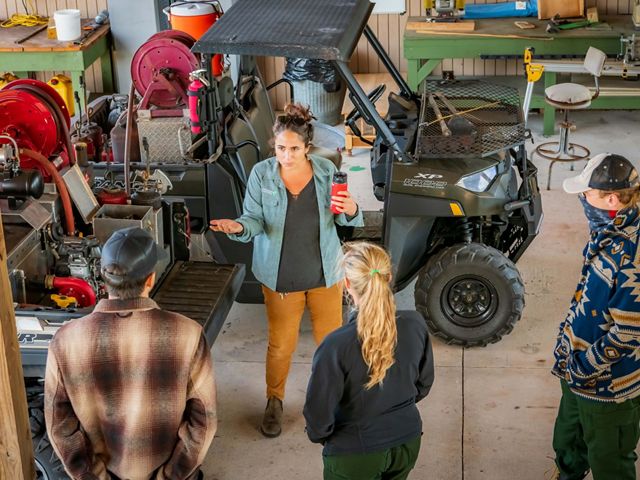 Preserve staff instructs interns in a workshop with fire equipment at Disney Wilderness Preserve.