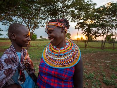 A woman smiles with her granddaughter