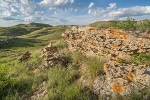 Rock escarpments in a rolling, native grassland.
