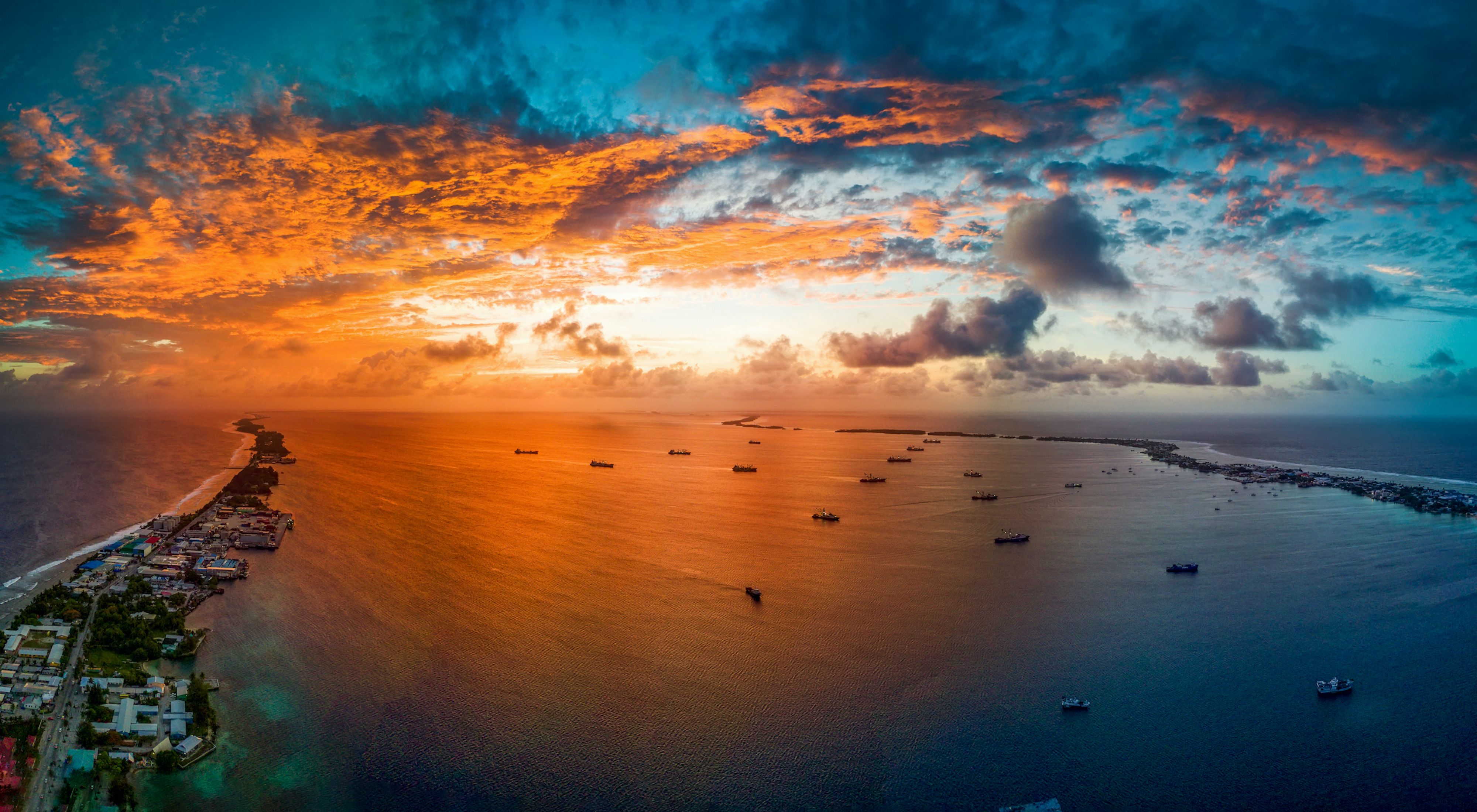 Fishing vessels in the Marshall Islands at sunset.