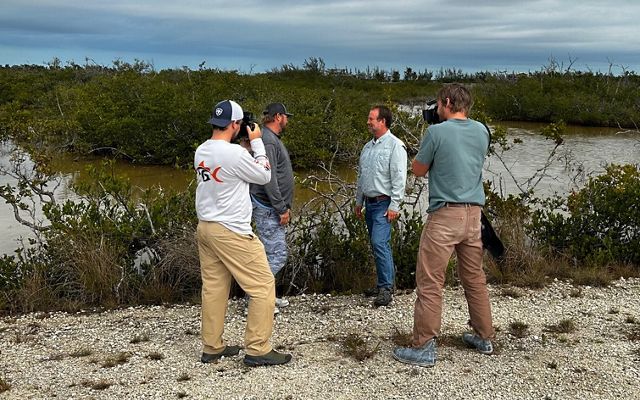 TNC fleld program director Chris Bergh is interviewed by Captain George Clark, Jr. of The Fish Guyz during a video shoot in Big Pine Key, Florida. 