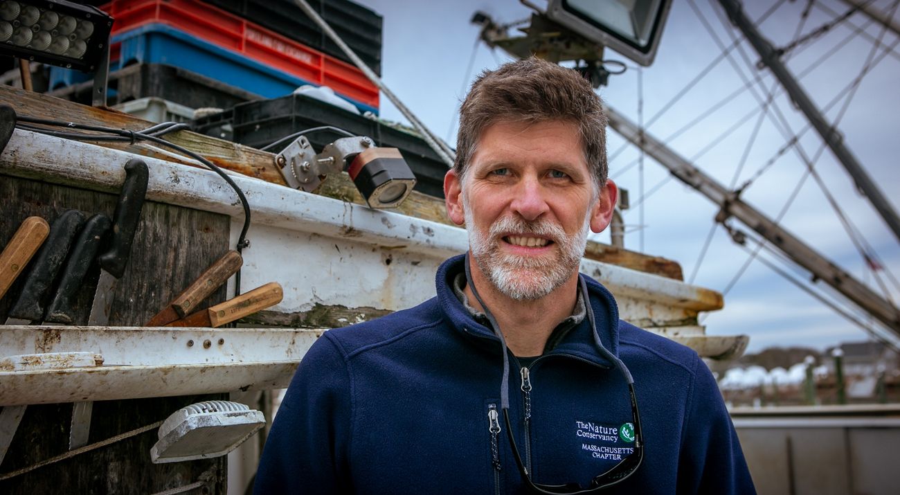 Close up of Chris McGuire on a fishing boat.