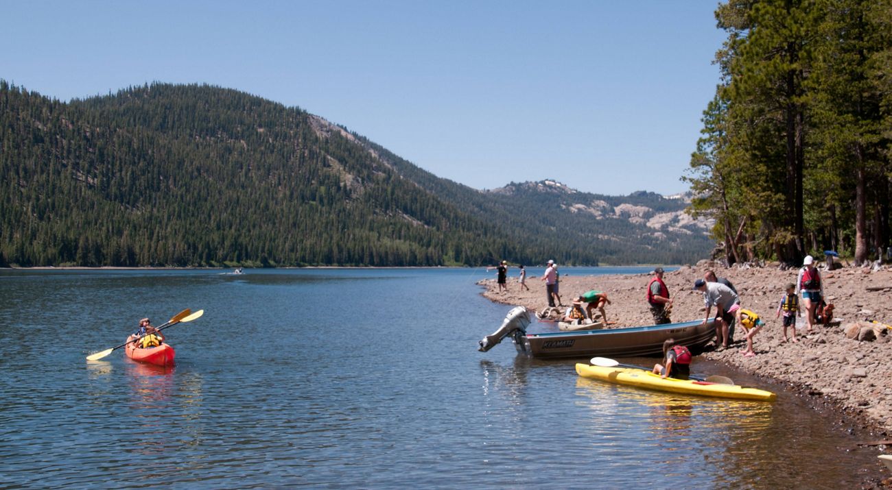 Visitors enjoying fishing from shore and small motorboats and using TNC’s fleet of kayaks on Independence Lake.