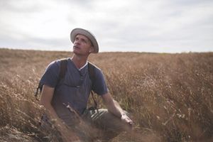 A photo of Four Canyon Preserve Manager Chris Hise on the open prairie.