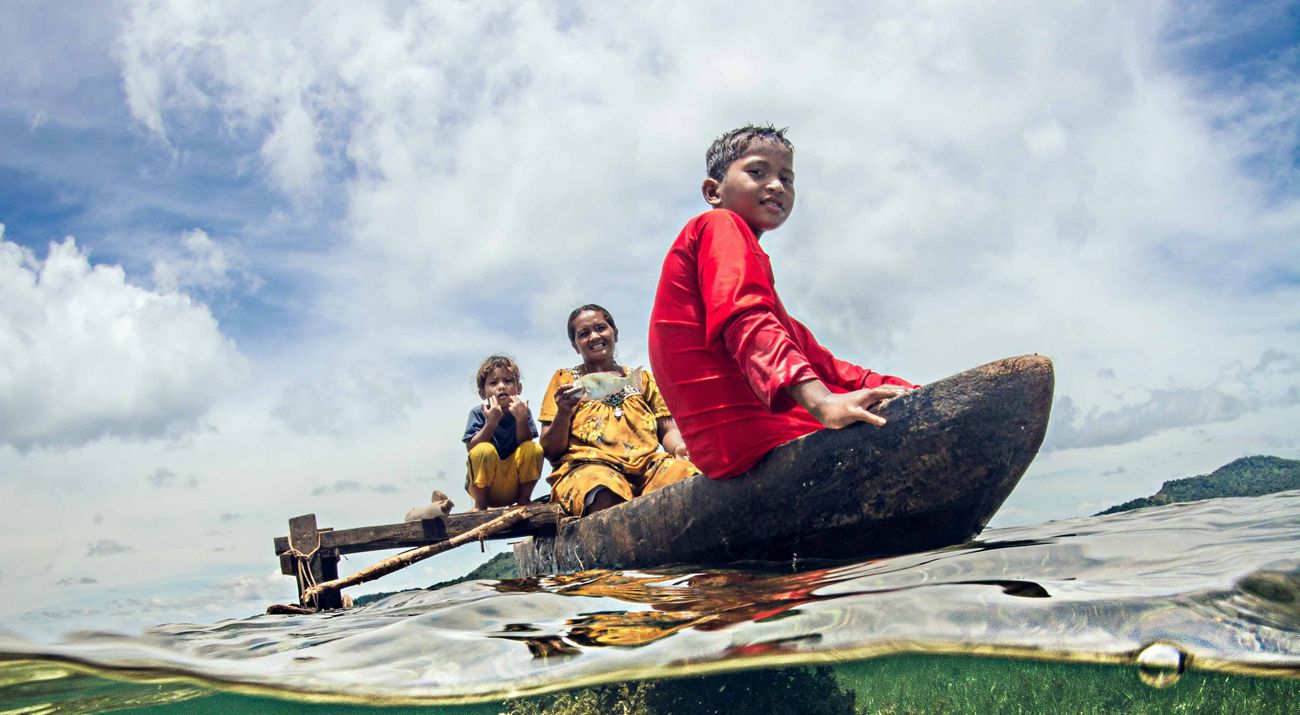 A family in Chuuk in their boat.