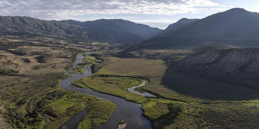 An aerial image of a river flowing through the ground.