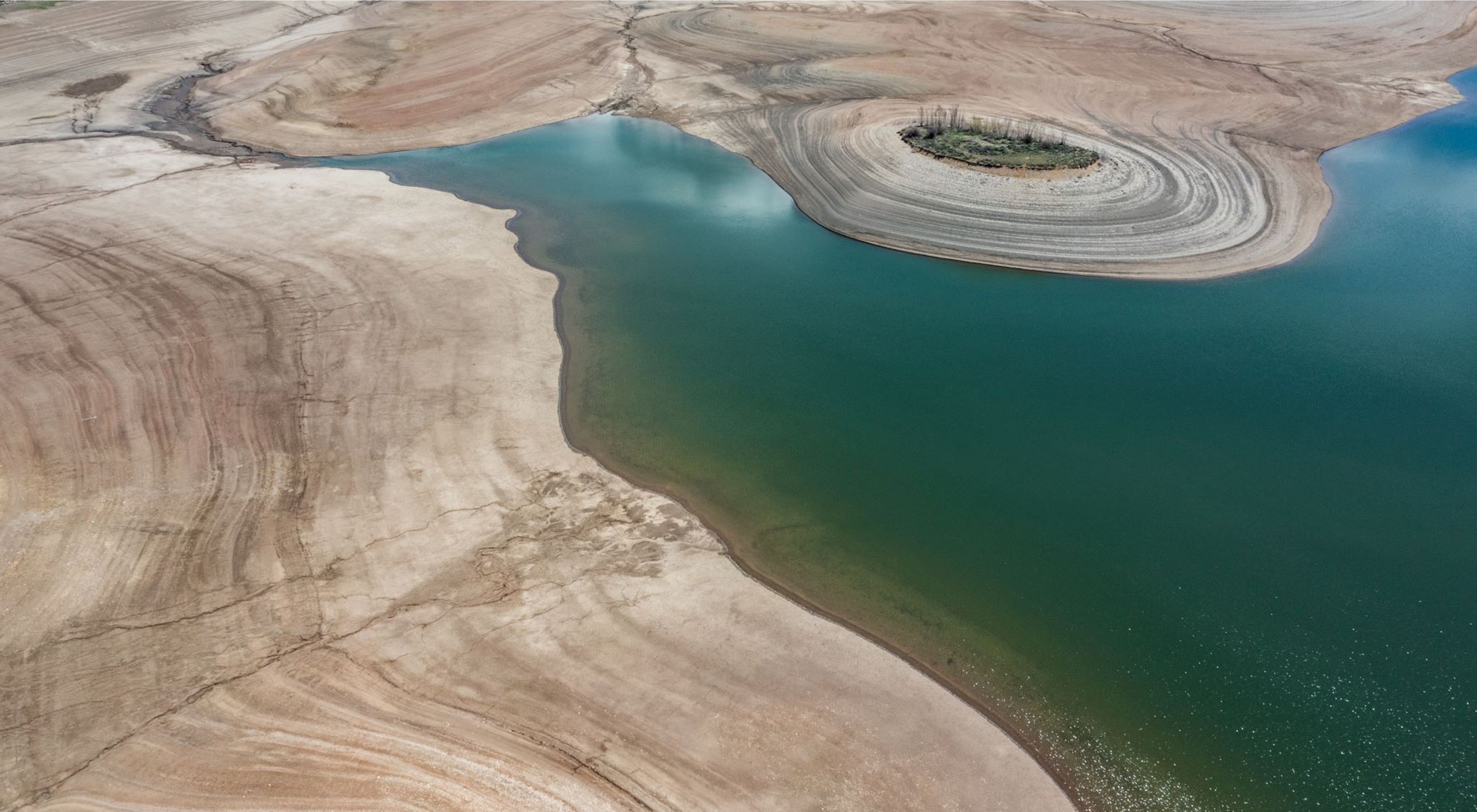 Aerial view of low levels of water in a reservoir.