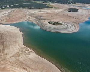 Aerial view of low water levels in a reservoir.