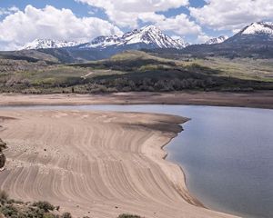 An aerial photo of a reservoir with low water levels.