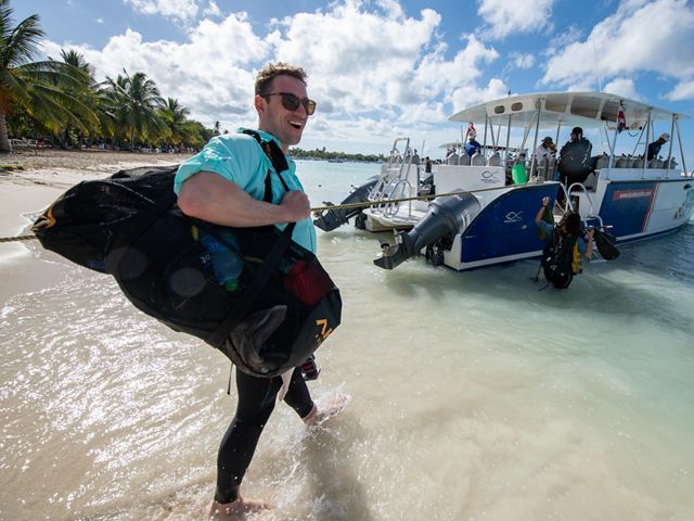 Joe Pollock, Coral Strategy Director, heads to the boat for a dive off the coast of the Dominican Republic.