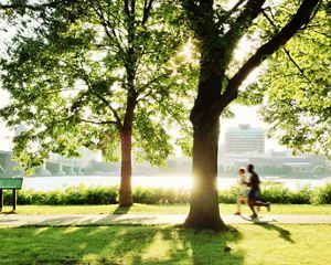 Joggers along the Charles River in Boston.