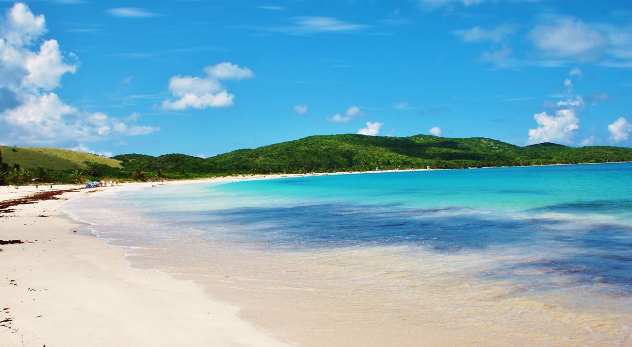 View of a beach with a mountain in the background, flamenco Beach, Culebra in Puerto Rico.