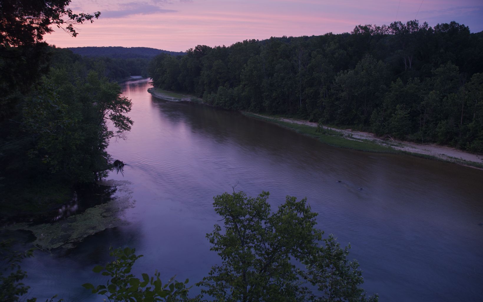 
                
                  Current River Sunset along the Current River
                  © Byron Jorjorian
                
              