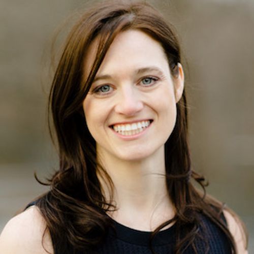 Headshot of Alexandra Conliffe in a black dress