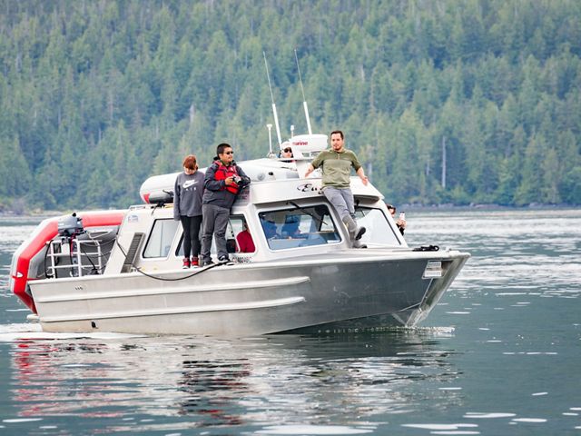 SEAS student Tina Lobbes on a boat with fishermen Justin and Vernon Brown in Great Bear.