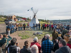 people stand in a circle in Lustel K'e Dene Northwest Territories to celebrate Thaidene Nene