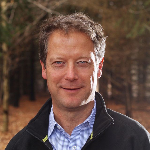 headshot of a smiling white man