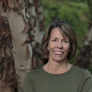 a local fisherman in the great bear rainforest pulls a net into his boat