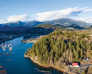 Aerial photo of a forest alongside a lake in the Northwest Territories.