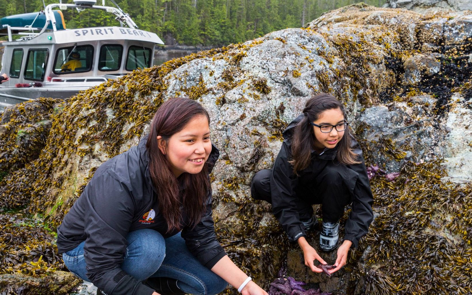 On-The-Land Learning Exploring tidepools during a break from harvesting traditional food including urchin, fish, sea asparagus, and berries near Klemtu, BC, Canada. © Jason Houston