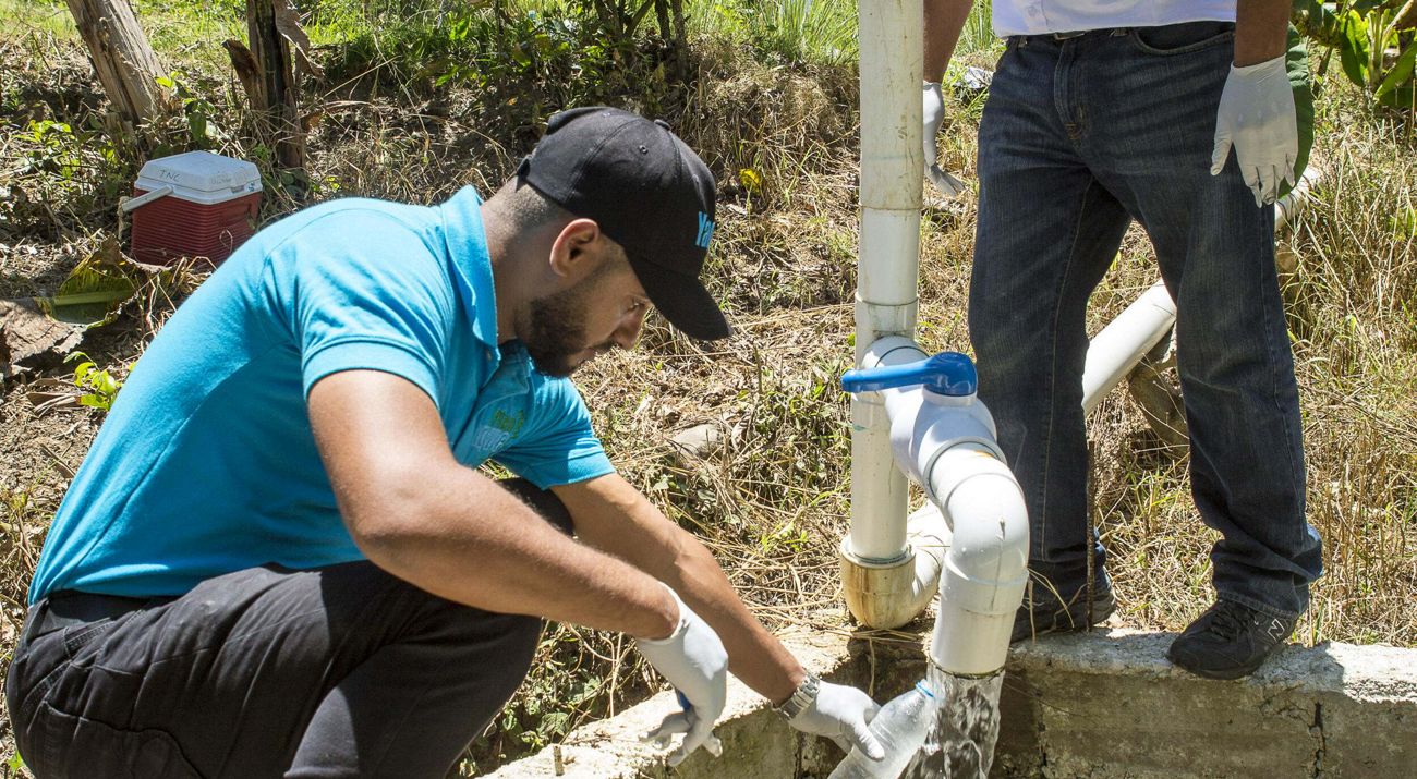 Members of the Wastewater Management team testing the water.