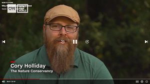 Screen grab from a video showing Cory Holliday talking on a news program.